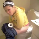 A Hispanic girl is having trouble pooping as her friend tries to videotape the event. Not sure if those are plops in the background or some other residual noise.